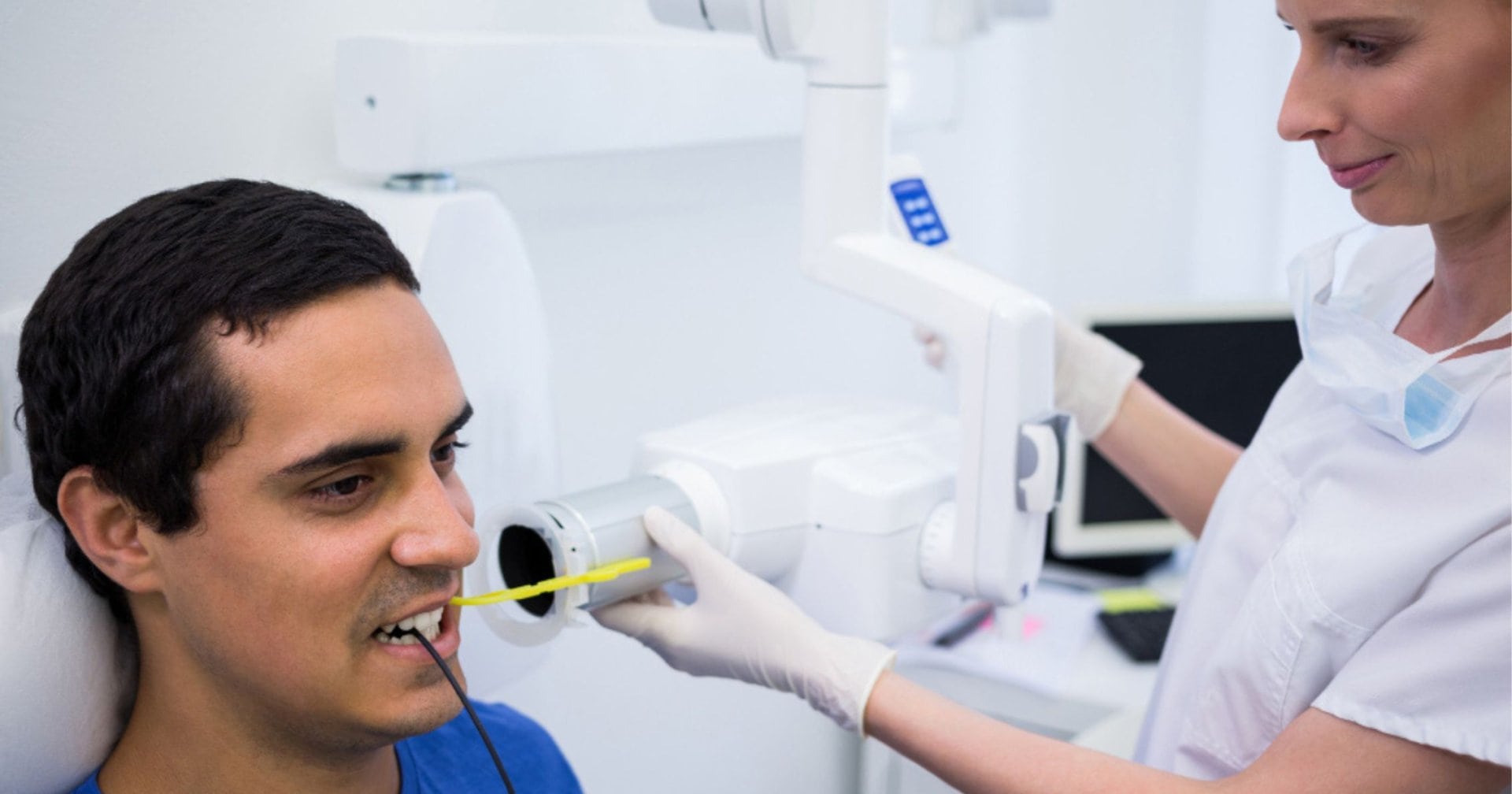 patient having a bitewing Xray taken during a dental appointment in Cheltenham